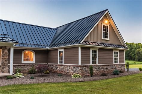 grey house with brown metal roof|gray siding black windows.